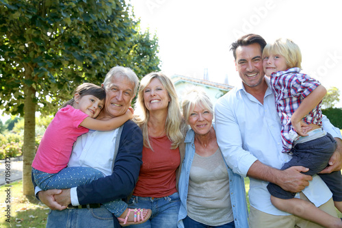 Happy 3 generation family in grandparents' backyard