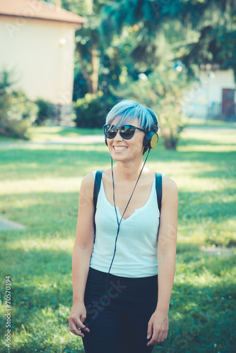 young beautiful short blue hair hipster woman with headphones mu © Eugenio Marongiu