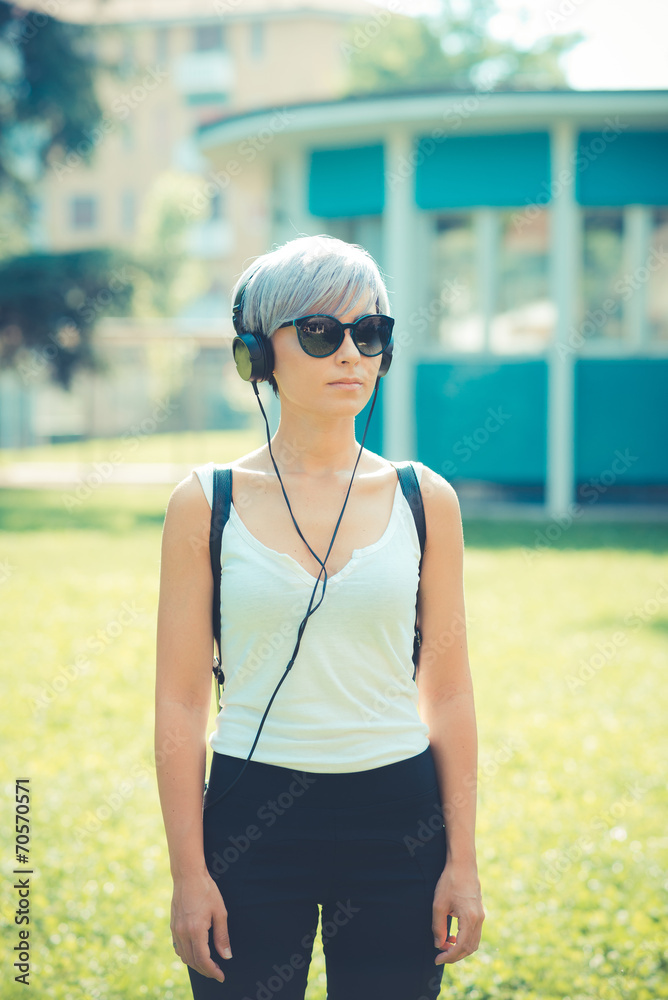 young beautiful short blue hair hipster woman with headphones mu young beautiful short blue hair hipster woman with headphones mu