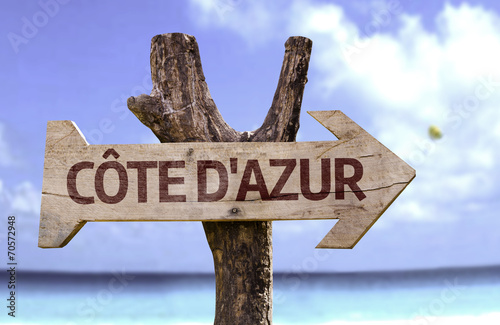 Photography Cote d'Azur wooden sign with a beach on background