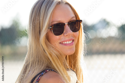 Young attractive woman with sunglasses on a summer day.