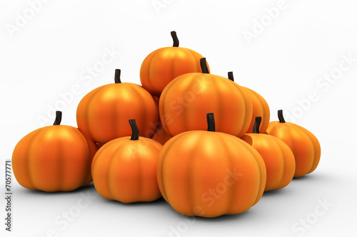 Orange pumpkins arranges in a pyramid.