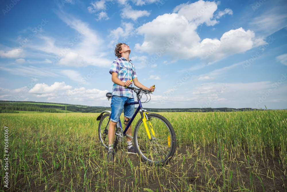 Portrait of a boy with a bicycle