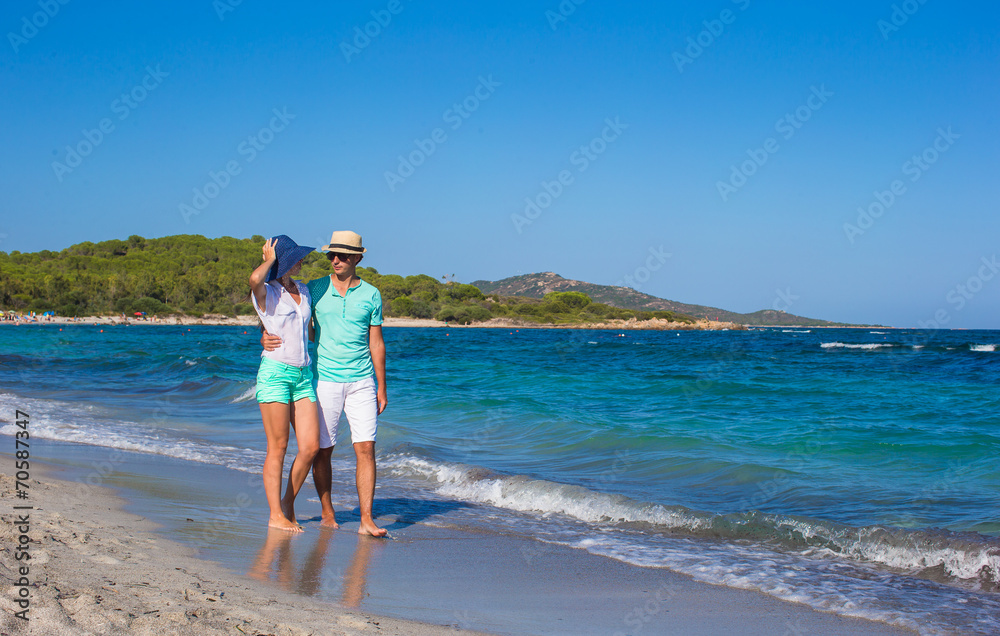 Romantic couple at tropical beach during summer vacation