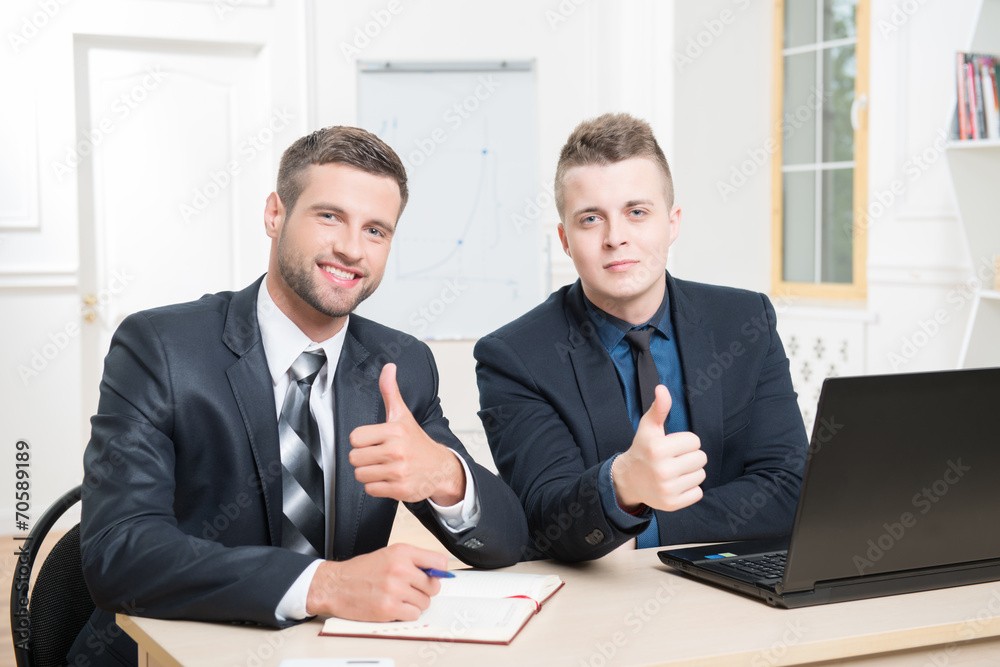 Waist-up portrait of two handsome businessmen in suits Waist-up portrait of two handsome businessmen in suits