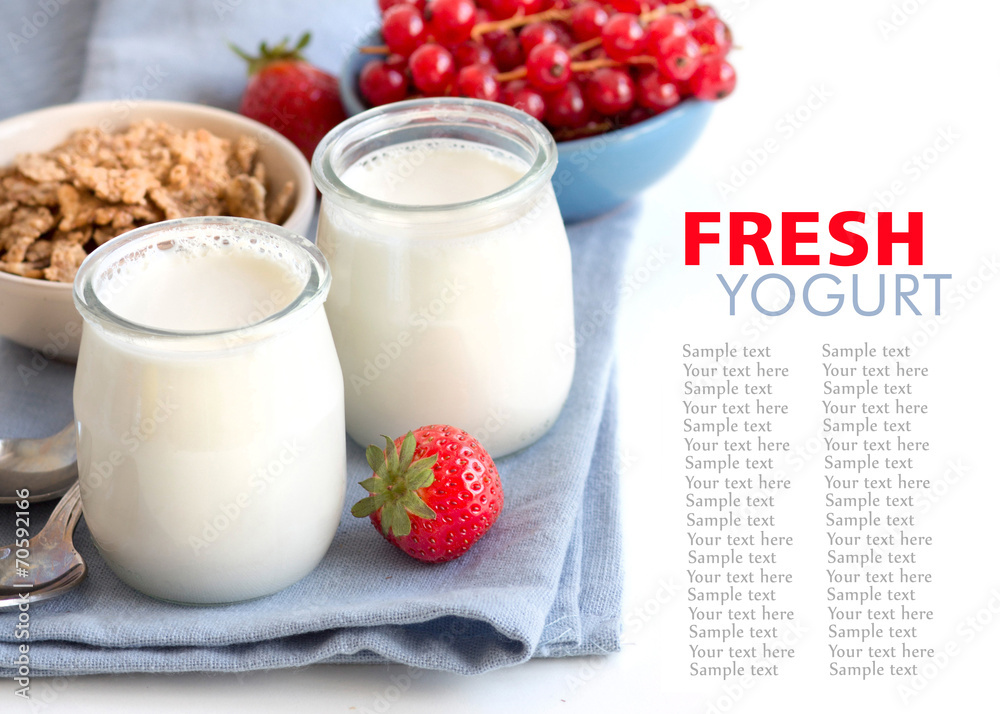 Jars of fresh natural yogurt, berries and muesli Jars of fresh natural yogurt, berries and muesli