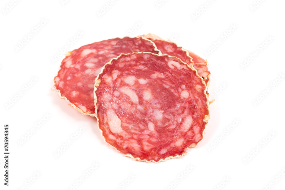 Slices of salami sausage on a white background Slices of salami sausage on a white background