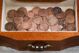 Oak antique dresser drawer filled with old Indian Head Cents