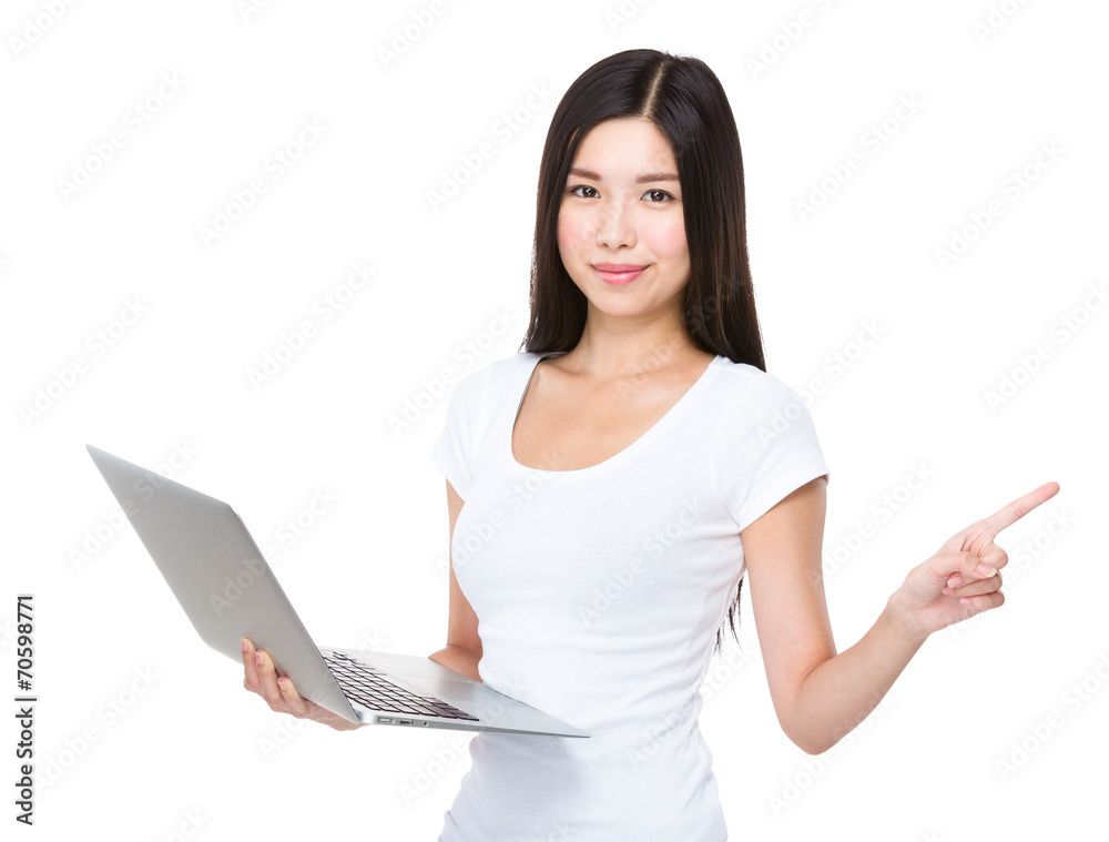 Asian woman use of notebook computer and finger point aside Asian woman use of notebook computer and finger point aside