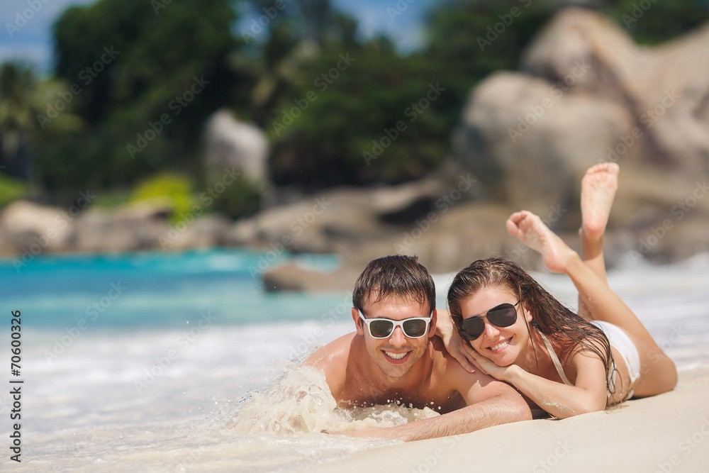 Fototapeta premium An attractive man and woman on the beach.