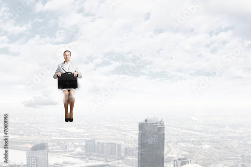 Woman on cloud © Sergey Nivens