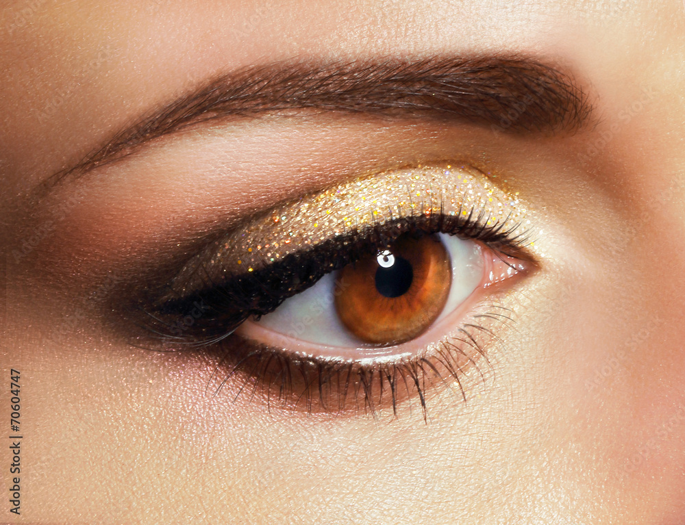 Mascara. Close Up Woman's Eye with Golden Eyeshadow Mascara. Close Up Woman's Eye with Golden Eyeshadow