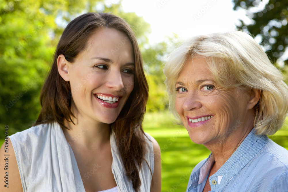Senior mother smiling with older daughter Senior mother smiling with older daughter