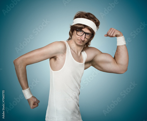 Funny retro nerd with one huge arm flexing his muscle photo