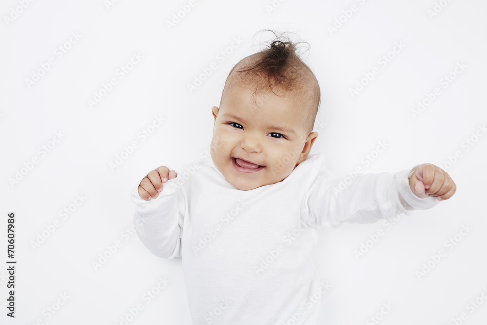Cheeky baby girl with mohican hairstyle in baby gro. Cheeky baby girl with mohican hairstyle in baby gro.