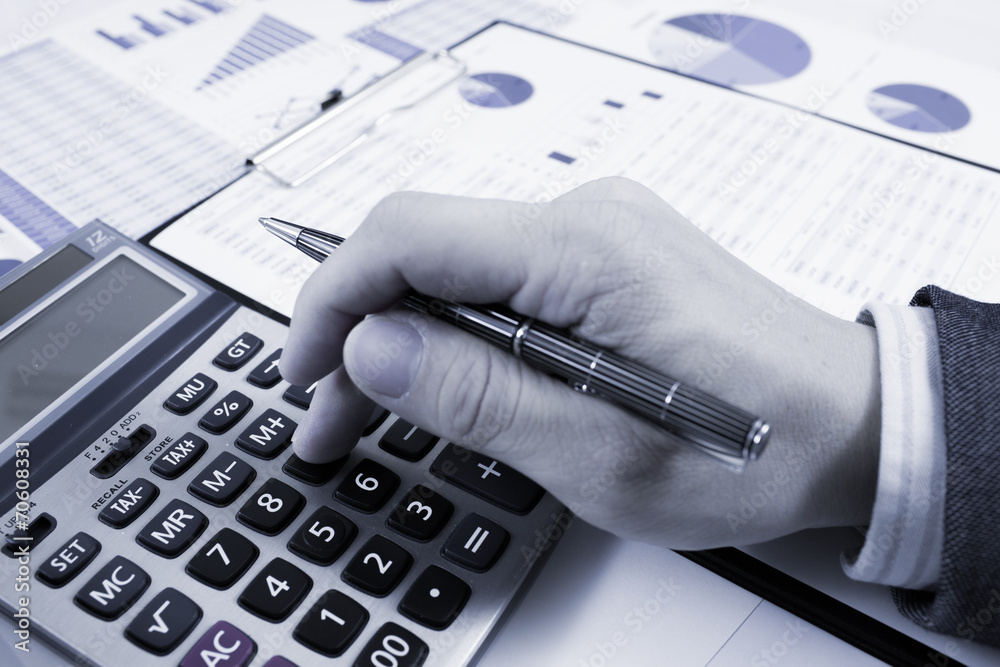 man hand with pen and business report. Accounting man hand with pen and business report. Accounting