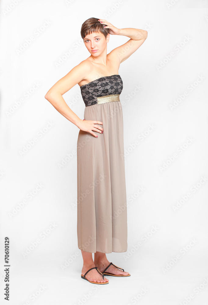 Fototapeta premium Young woman dressed in retro style evening dress.