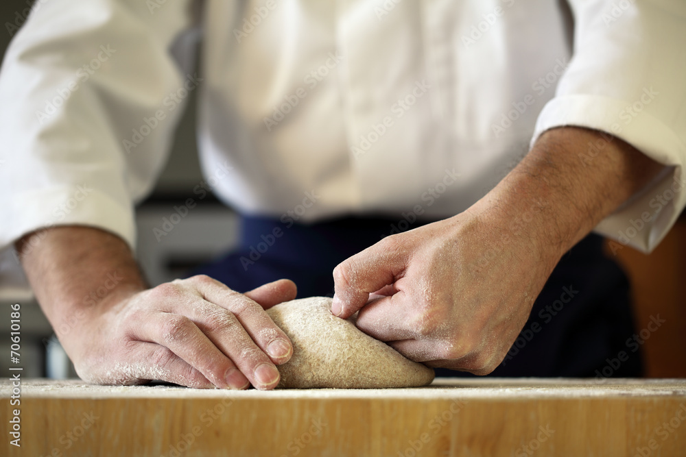 Chef kneading yeast dough