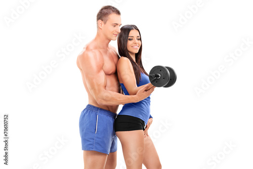 Fitness coach exercising with a female athlete