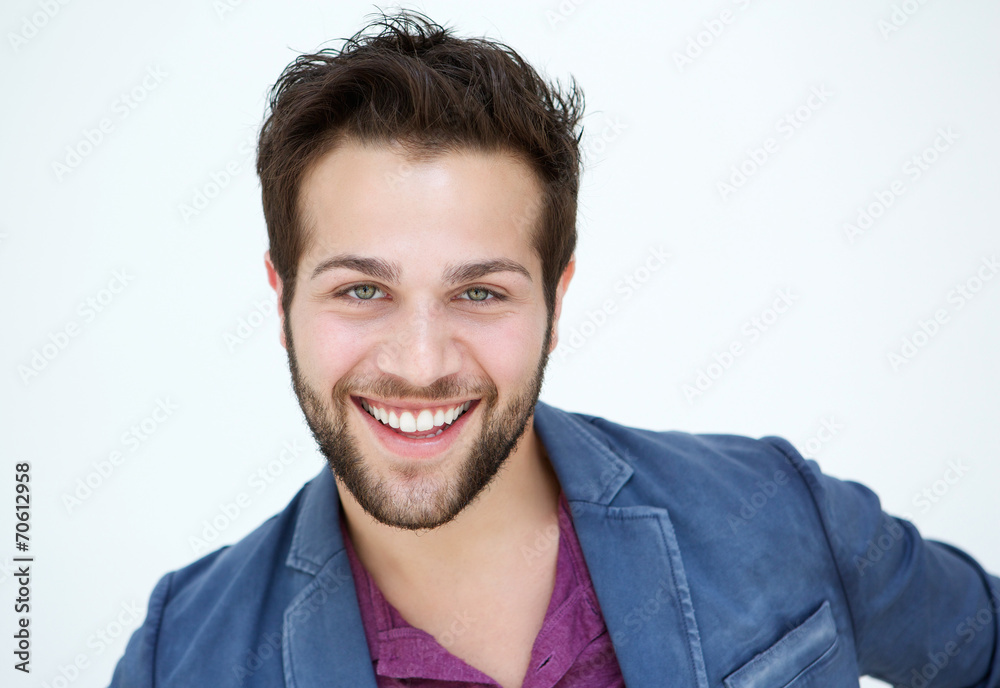 Attractive young man with beard smiling on white background Attractive young man with beard smiling on white background