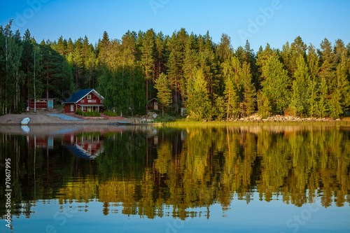 Fototapeta Naklejka Na Ścianę i Meble -  Forest reflecting in lake