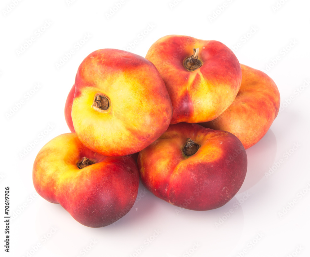 flat peaches (donut peaches) on a background flat peaches (donut peaches) on a background