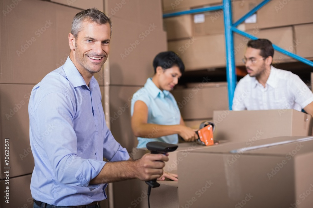 Fototapeta premium Warehouse workers preparing a shipment
