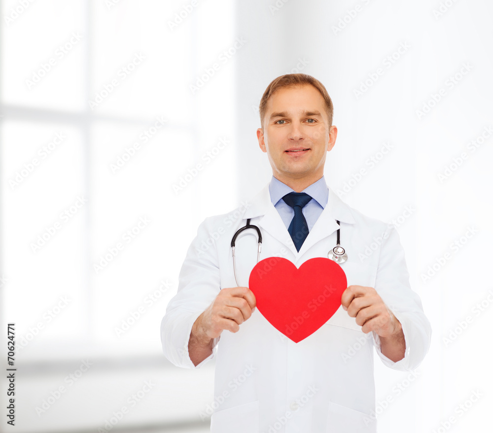 smiling male doctor with red heart and stethoscope smiling male doctor with red heart and stethoscope