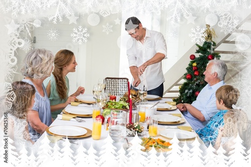 Composite image of father serving christmas meal to family