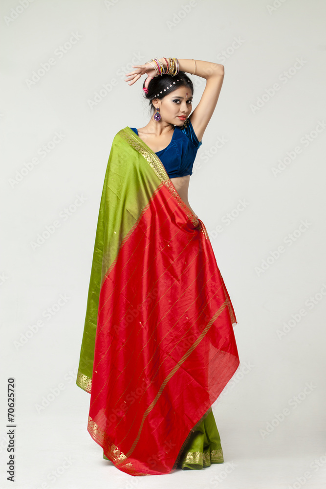 Young pretty woman in indian green dress
