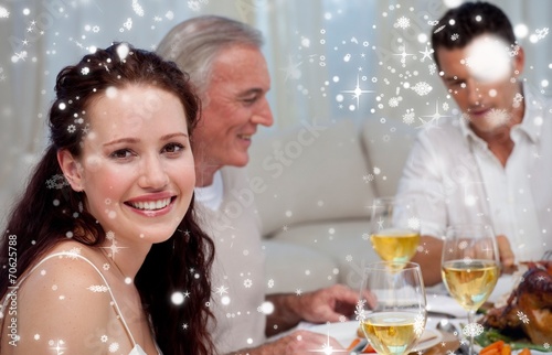 Woman celebrating christmas dinner with her family