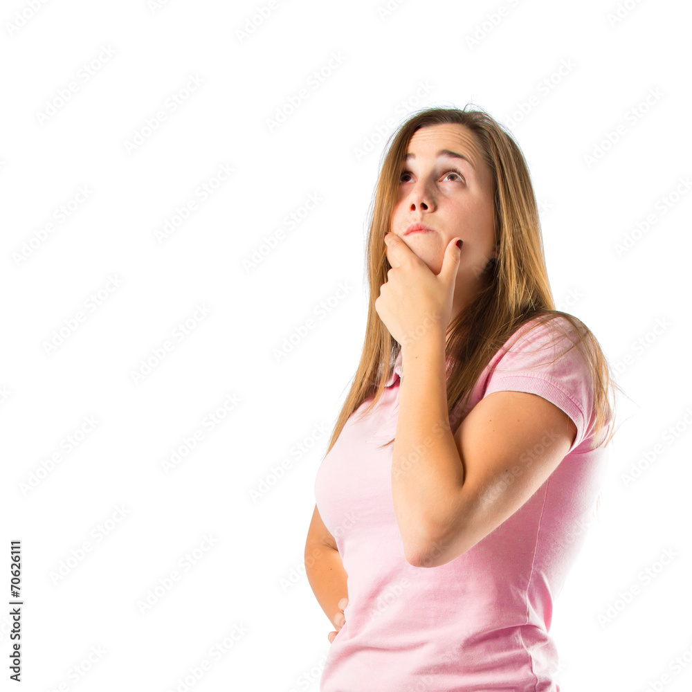 Girl thinking over isolated white background Girl thinking over isolated white background