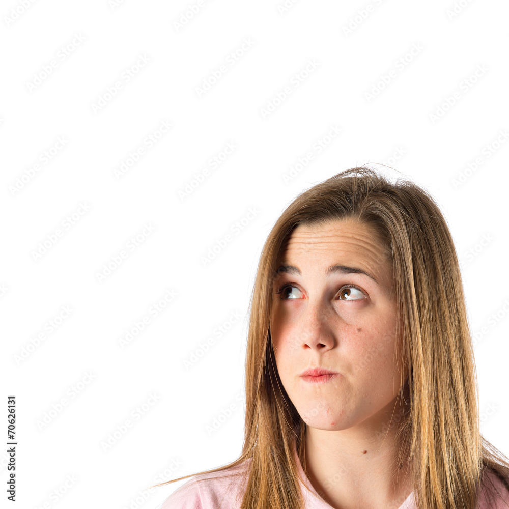 Girl thinking over isolated white background Girl thinking over isolated white background