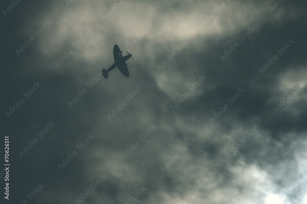 Fighter plane on cloudy sky Fighter plane on cloudy sky