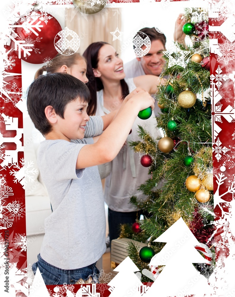 Happy family decorating a christmas tree with boubles Happy family decorating a christmas tree with boubles