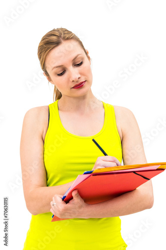 woman hold a folder of papers and write