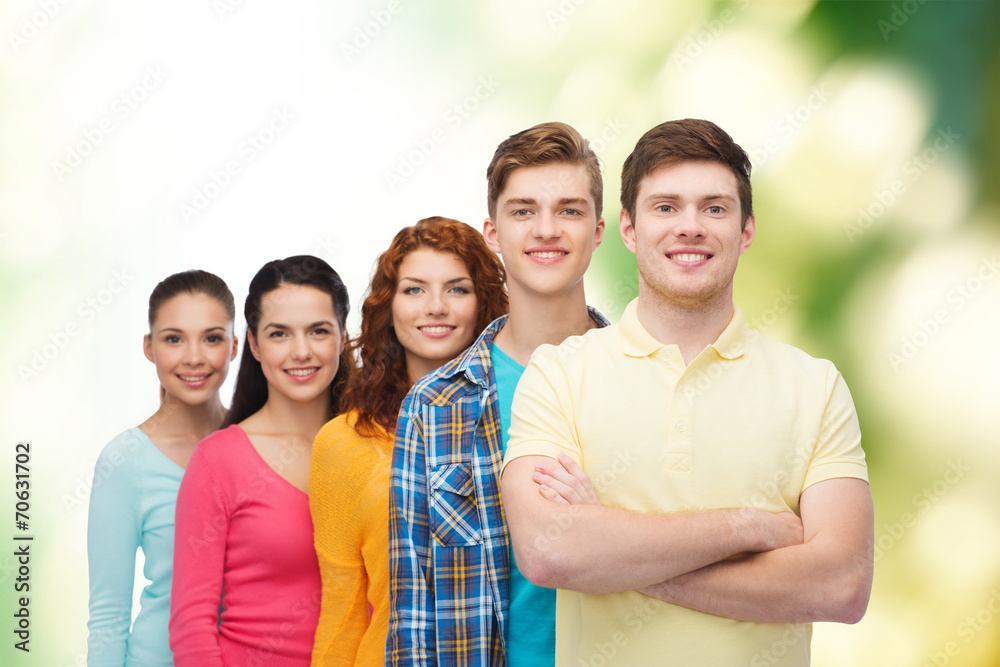 group of smiling teenagers over green background group of smiling teenagers over green background