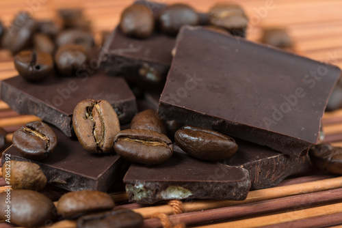 chocolate and coffee beans on brown bamboo background