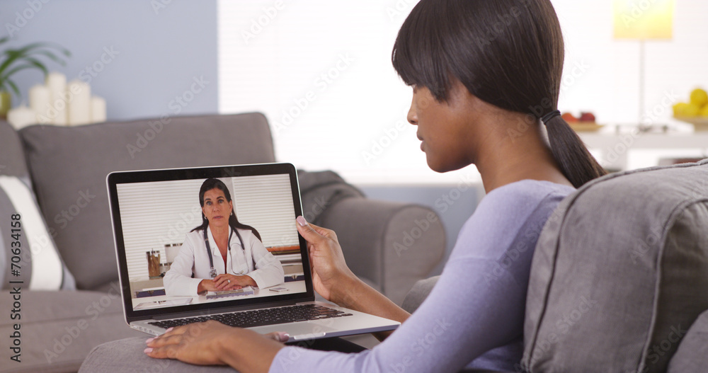 African woman video chatting with doctor African woman video chatting with doctor