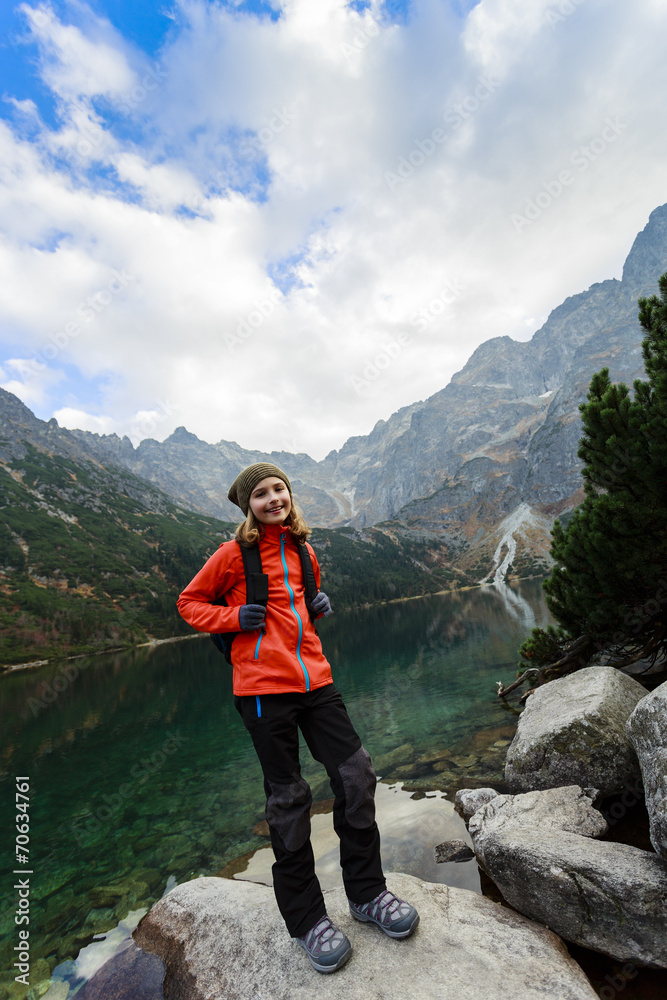 Obraz premium Hiking, trekking - young girl on mountain trek