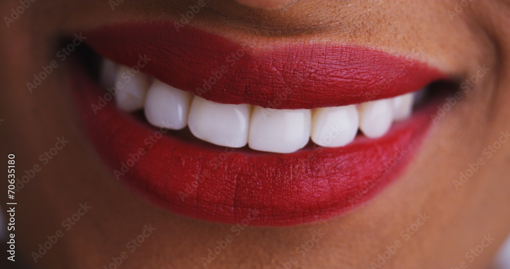 Close up of african woman smiling and kissing Close up of african woman smiling and kissing