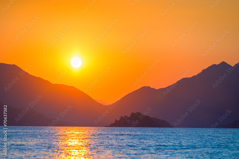 very beautiful sun rises over the sea