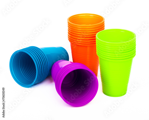 Bright plastic cups isolated on white
