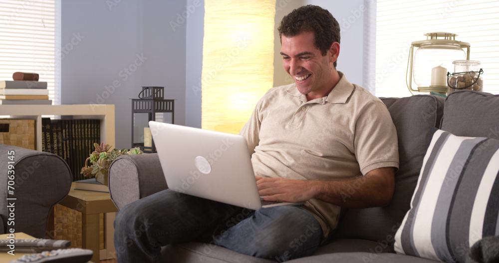 Man watching the game on his laptop Man watching the game on his laptop