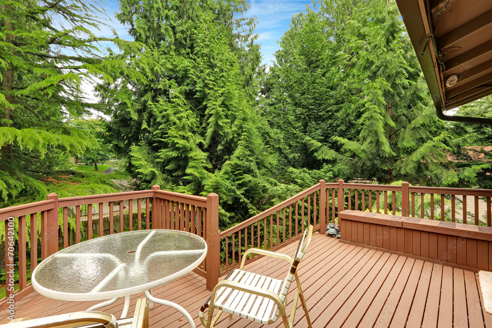 Wooden walkout deck with patio area Wooden walkout deck with patio area