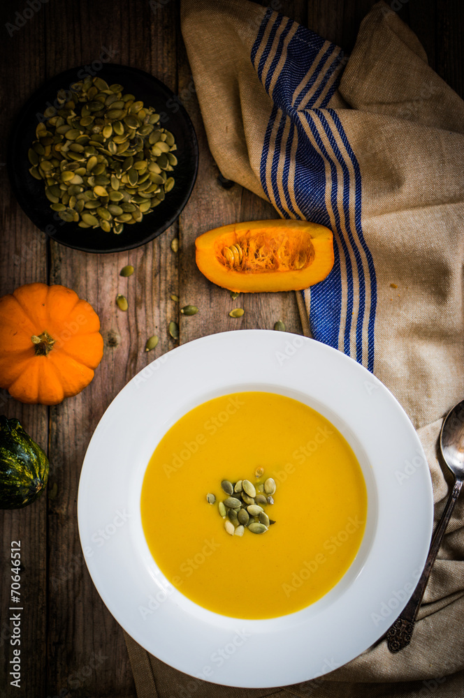Pumpkin soup on wooden background Pumpkin soup on wooden background