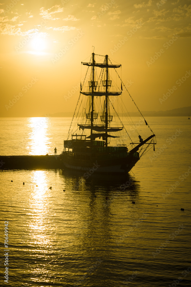 Evening. Sailboat in the bay.