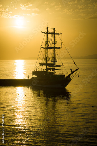 Evening. Sailboat in the bay.