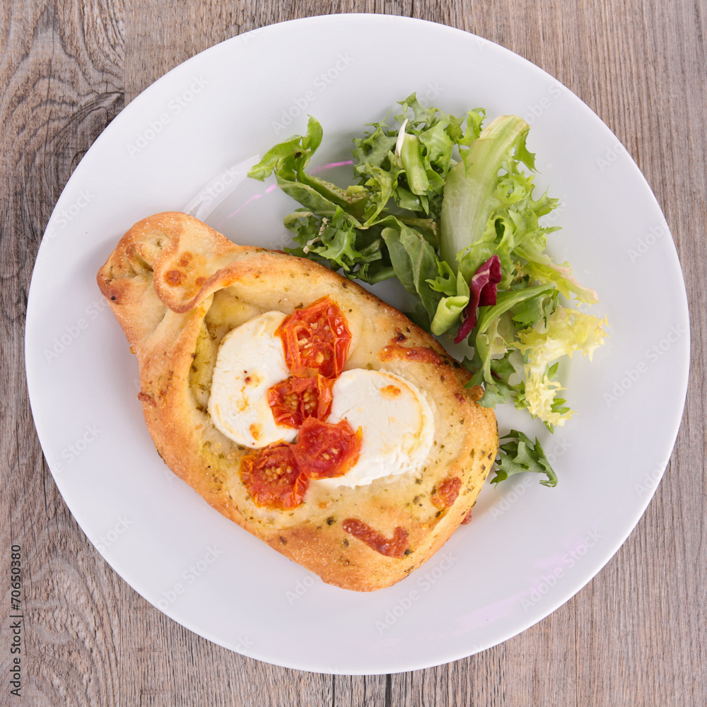 baked bread with cheese, tomato