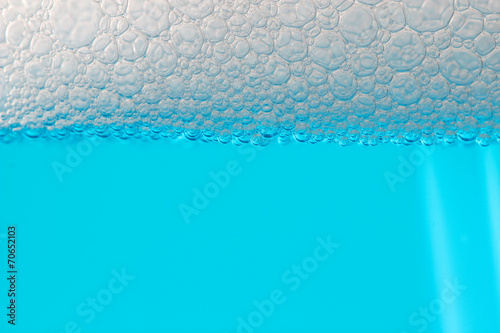 Detail bubbles in blue liquid.